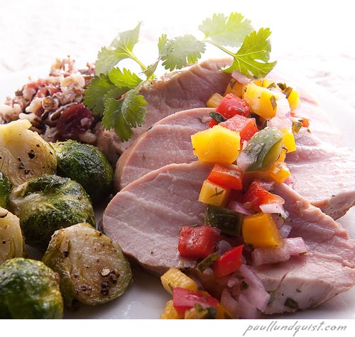 Pork and brussel sprouts with Mango salsa plated dinner.